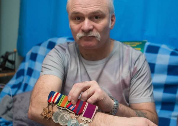 Davey Archibald from Glenrothes wants to return the WW2 medals found in the British Legion safe. (Pic Steve Brown).
