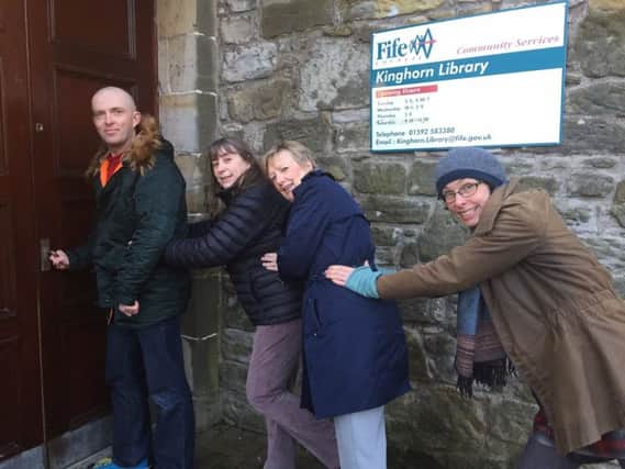 From left,  Andrew Bentley-Steed, Diane Diggins, Elizabeth Whitton & Catherine Lindow try to get into Kinghorn Library. Their plans for new community library service have been held up by Fife Council which failed to give it a lease or entry date until this week - less than a week before the current service ends.