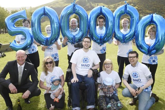 Gordon Aikman celebrates raising Â£500,000 for MND (Pic Greg Macvean)