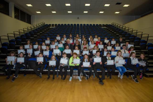 Pictured:  All the kids with their awards kids who took part in the competition, with centre Cllr Bryan Poole, MSP Jenny Gilruth and St Andrews University Julie Ramsay