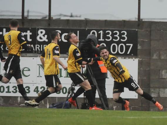 Chris Duggan leads the celebrations after his penalty restores parity. Picture by George McLuskie.