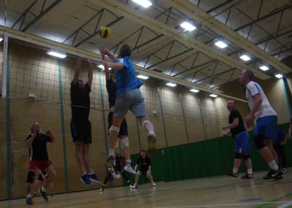 Mental Eagles hitter Iain Cook attempting to breach the Scotrange blockers