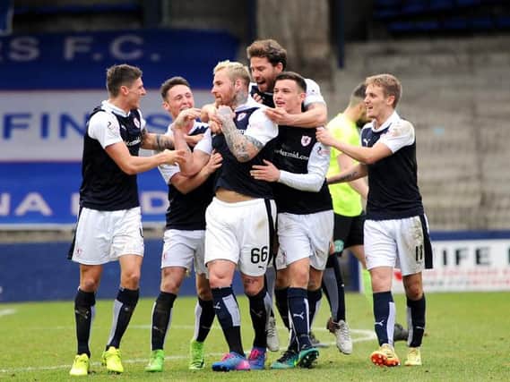 Ryan Stevenson is mobbed after his stunning strike put Raith 1-0 up on Hibs. Pic: Fife Photo Agency