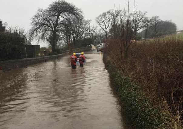 An elderly couple were rescued from their car. Picture: Contributed