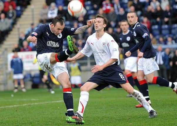 Kevin McBride pictured in action for Raith against current club mate Mark Stewart in a match against Falkirk in 2011. Pic: Neil Doig