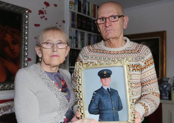 Mary and Oliver McKeague, Corrie's grandparents, with a picture of the missing airman