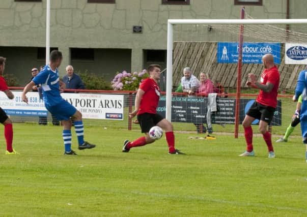 Tayport's Gregor Anderson blocks a close range effort during his first spell at the club. The defender has now returned on loan from Montrose.