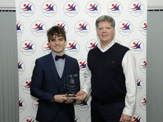 Chad Smith (ice hockey) receives his Youth Award trophy from Willie MacGregor of MacGregor Solicitors. Kirkcaldy & Central Fife Sports Awards 2016. Pic: Cranston Imagery