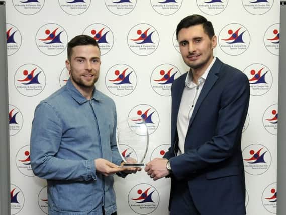 Lewis Stevenson (right) receives the Sports Star of the Year award from Fife Free Press sports editor Matthew Elder at the Kirkcaldy and Central Fife Sports Council 2016 awards night at Fife College.