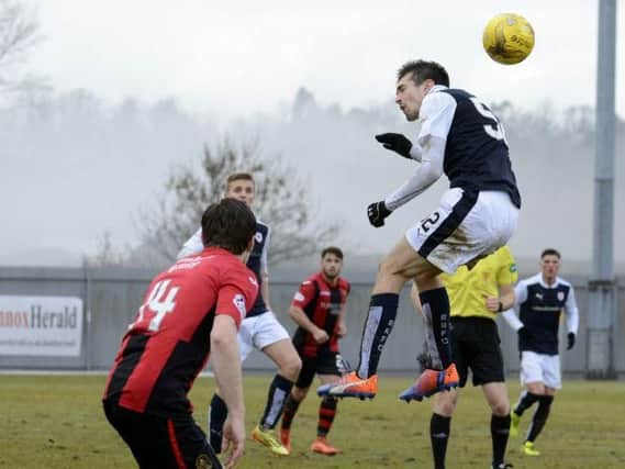 Ryan Hardie challenges for a high ball in the defeat to Dumbarton. Pic: Eddie Doig