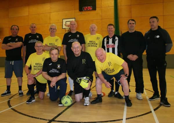 Brian Duncan, front row far left, with Kirkcaldy Leisure Centre Walking Football participants in yellow shirts, and, players from East Fife Walking Football, and, SFA coach, Dave Costello, back row far right.