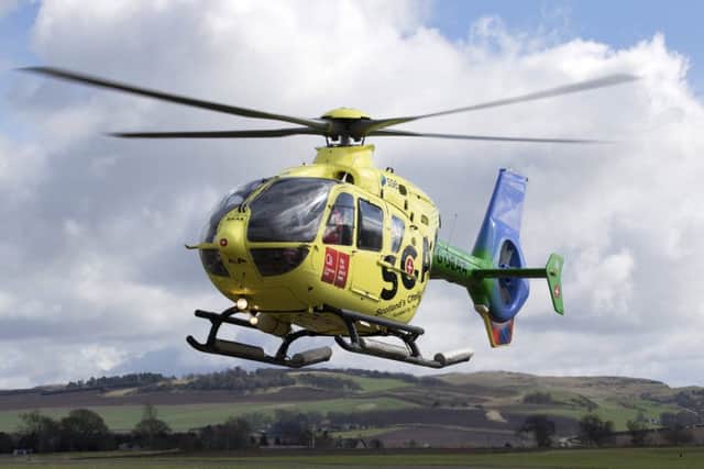 Scotland's charity air ambulance -  pilot Captain Russell Myles comes into land. Pic:  Graeme Hart/Perthshire Picture Agency