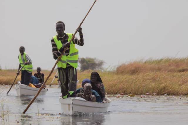 Oxfam canoes transporting vulnerable people who could not make it by themselves to the mainland for the WFP biometric food registration. The UN announced an emergency food situation level 4 in Panyijiar County on February 20, 2017. Pic: Bruno Feder.