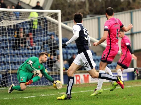 Ryan Hardie sends the ball past Dundee United goalkeeper Cammy Bell for Raith's second goal. Pic: Fife Photo Agency