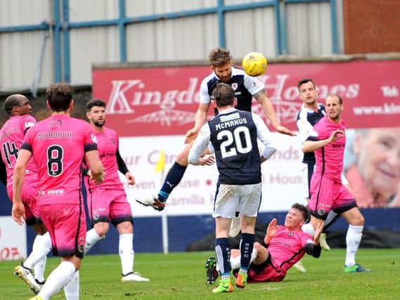Raith defender Craig Barr powers home a header to put Raith 1-0 up during Saturday's match against Dundee United. Pic: Fife Photo Agency