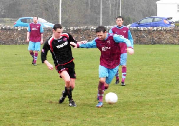 Ryan Gray works some space for himself as Cupar Hearts go on the attack.
