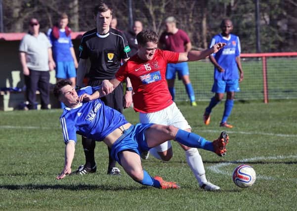Marc Ogg finds himself in the thick of the action for Tayport. Picture by Dave Scott.