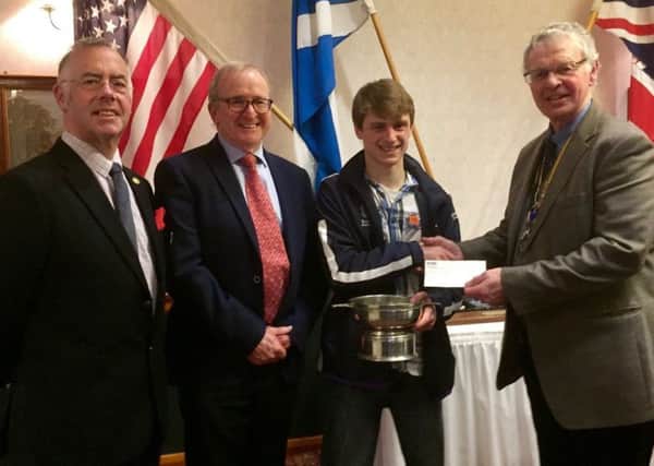 Ollie is presented with  the St Andrews Kilrymont Rotary Club Quaich and a Rotary Bursary.