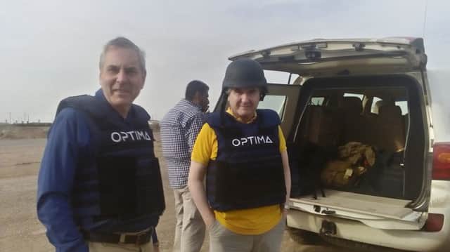 Roger Mullin with security personnel from Optima