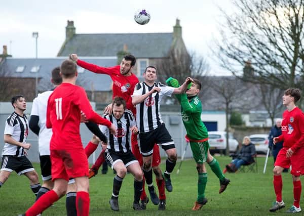 Action during the Tom McIntyre Memorial Cup Group B match between Pittenweem Rovers & AM Soccer Club at Pittenweem. Photo by Craig Doyle