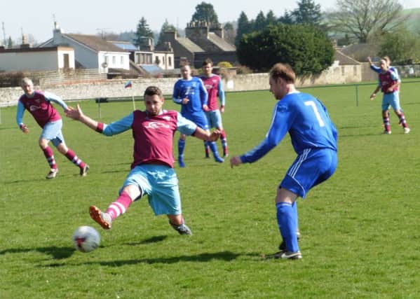 Ryan Gray gets his toe to the ball for Cupar.