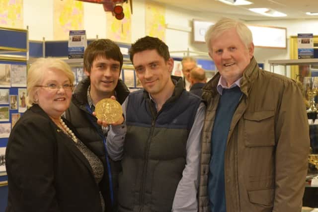 Linda Ballingall chairman of Glenrothes Heritage Centre, with Ross and Gavin Baxter and historian Ian Nimmo-White. (Pic George McLuskie).