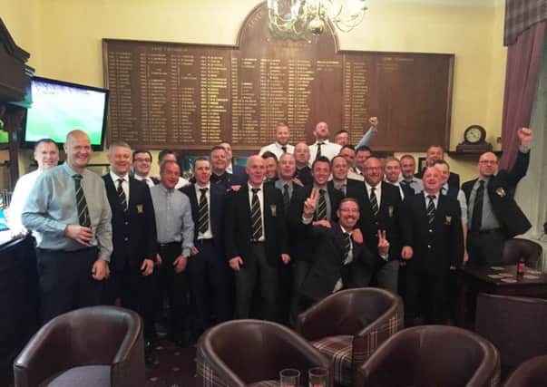 Some of the victorious Leven Thistle golfers celebrate in the clubhouse.