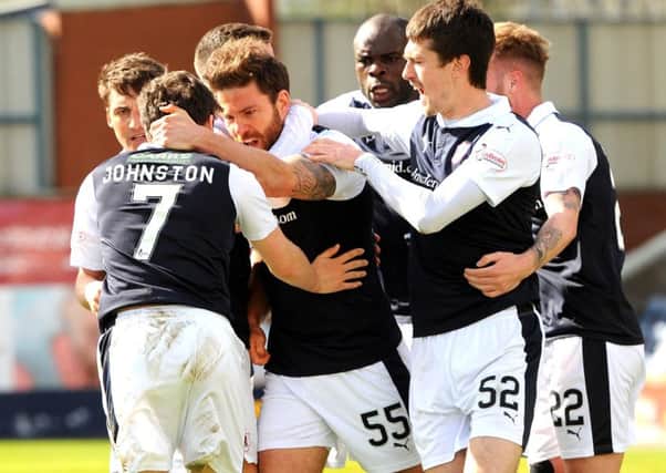 Craig Barr is mobbed by his team mates after scoring the opening goal against Morton -  credit- Fife Photo Agency