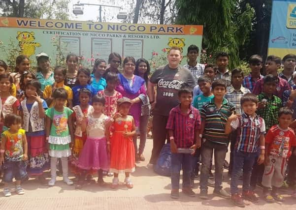 Ross pictured with the children of the Arunima Hospice on their trip to Nicco Park in India.