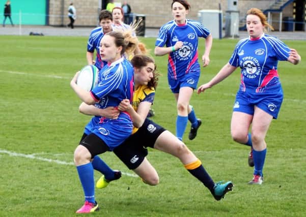 Samantha Lowe feels the force of a Garioch tackle. Pic: Michael Mellon