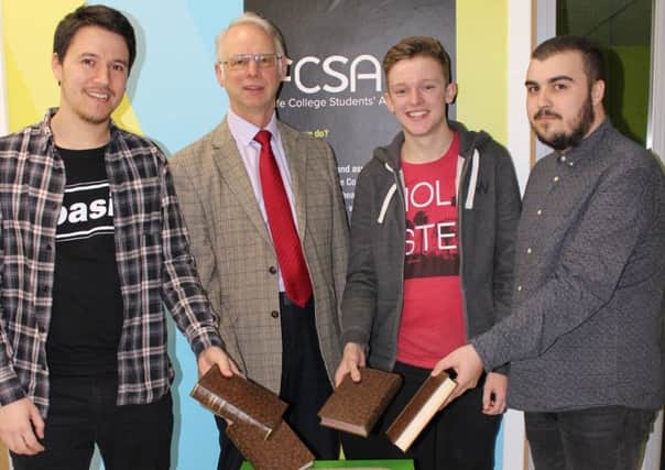 Students Steven Pitcaithly, Ross Lindsay and Lewis Laird with John Wincott, sustainability adviser.
