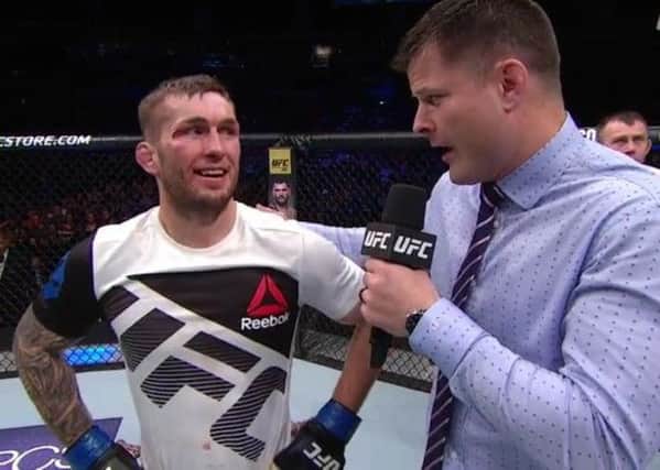 A smiling Stevie Ray is interviewed in the octagon after his victory over Joe Lauzon.
