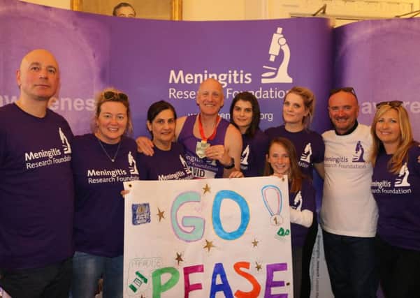 David Pease, centre, of Auchtermuchty, with friends and family after the London Marathon, which he ran to raise money for Meningitis Research Foundation.