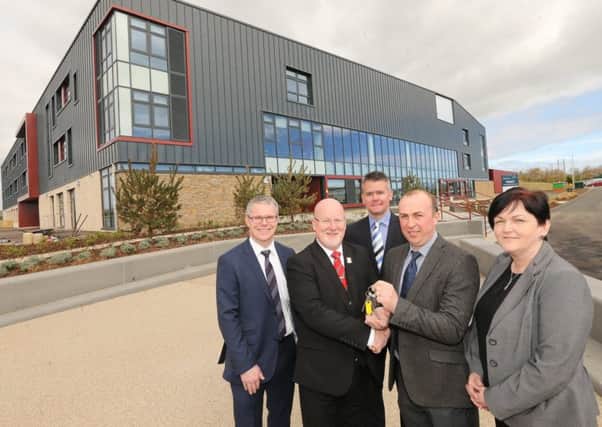 The keys to the new Waid Community Campus were handed over at a ceremony.
