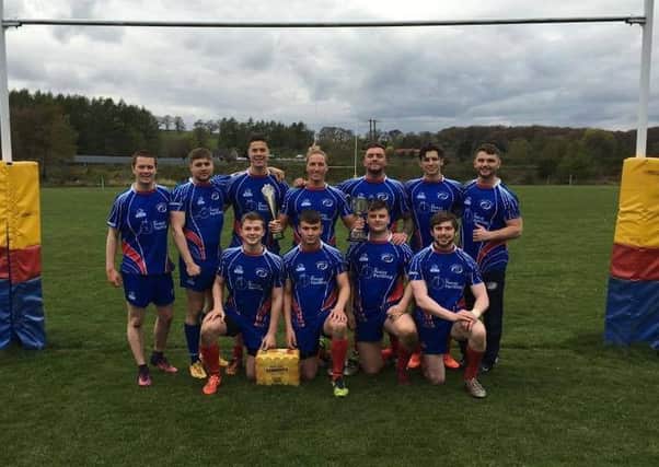 The victorious Kirkcaldy squad at the Crieff 7s with captain Kurt Littlejohn (centre) holding the trophies.