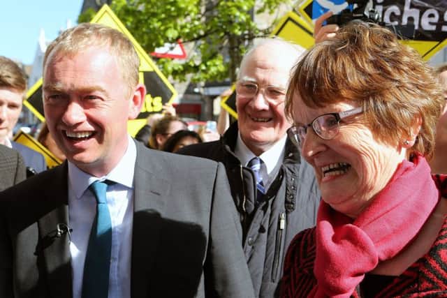 Tim Farron (left) in St Andrews with local candidate Elizabeth Riches and former North East Fife MP Lord Campbell.