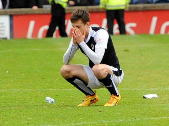 Raith loan striker Ryan Hardie holds his head in his hands after defeat to Brechin which confirmed the club's relegation. Pic: Fife Photo Agency