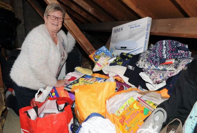 Janice with her donations for Uganda. Pic by George McLuskie