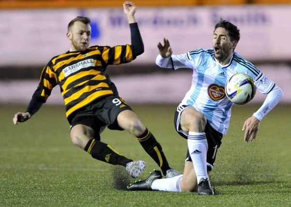 Alloa's Greig Spence brings down Hearts Miguel Pallardo Gonzalez in a match in January, 2015.  Picture Ian Rutherford