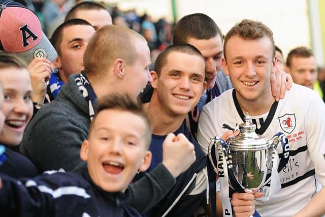 Greig Spence celebrates winning the Ramsdens Cup with fans in 2014. Pic: Neil Doig