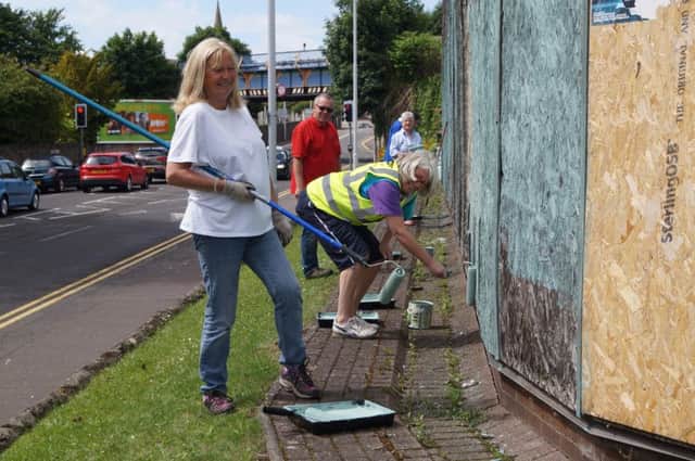 Alice Soper and volunteers help give the old Volvo garage on Abbotshall Road a makeover