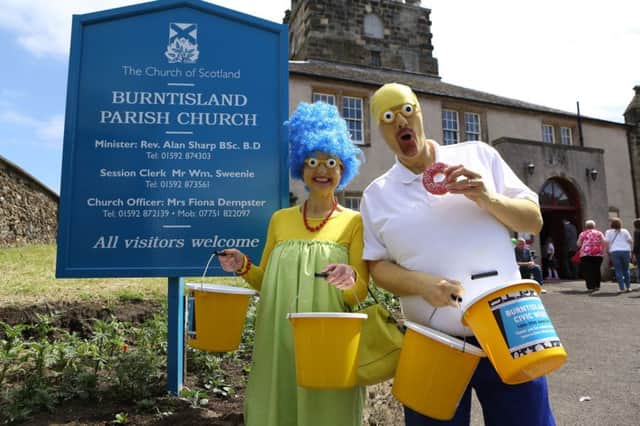 Marge and Homer Simpson were just two characters who made an appearance at the parade. Pics by David Cruickshanks