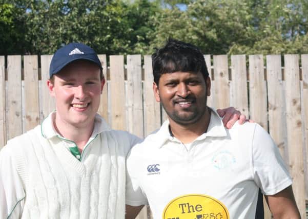 Andrew Eglinton, left, and Naveen Kumar of Largo Cricket Club.