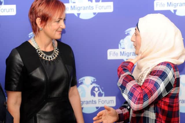 Equalities Secretary Angela Constance visiting Fife Migrants Forum to announce new funding  - Speaking with refugee Tahan (Pic: Fife Photo Agency)