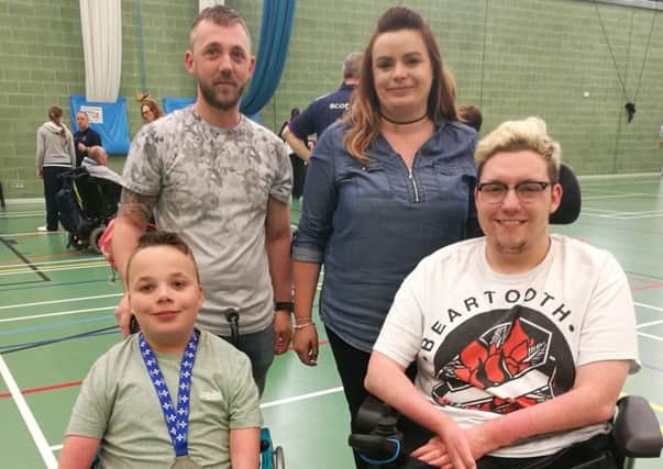 Boccia player Tyler McLelland,  from Glenrothes, left, with his parents, Mark and Emma, and, right, Kieran Steer.
