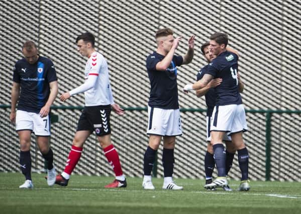 Liam Buchanan is congratulated by his colleagues after scoring Raith Rovers' opening goal at Broadwood (pictured by Craig Halkett)