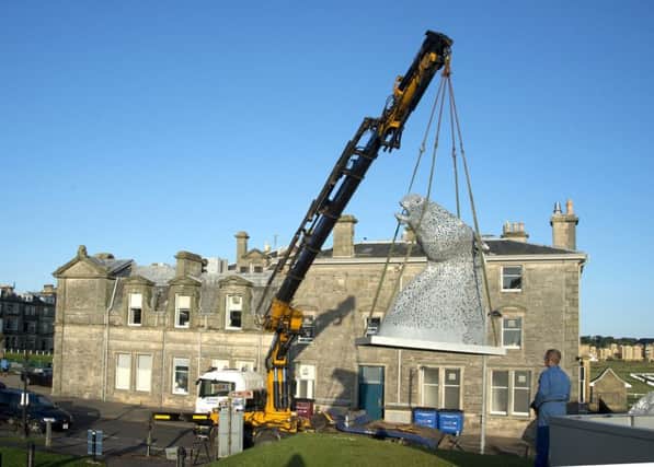 Kelpie Maquettes being lowered into position in St Andrews. (Peter Adamson)