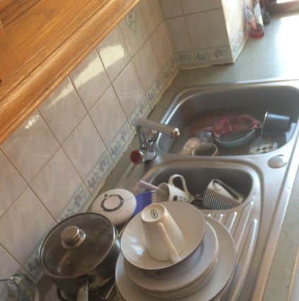 The family found pots left in the kitchen sink when they left the house 33-days ago, remained untouched. (Pic Neil Henderson FFP).