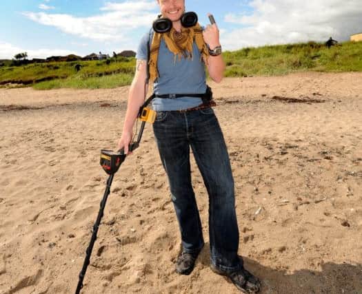 Liam on Seafield beach where he found the ferrule
