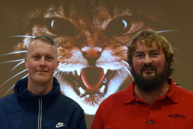 Wildcat whisperer...Kevin Bell (left) and Dr Paul O'Donoghue were delighted with the video of the very high purity wildcat, which was caught on camera in Aberdeenshire. (Pic Clive Marsden)